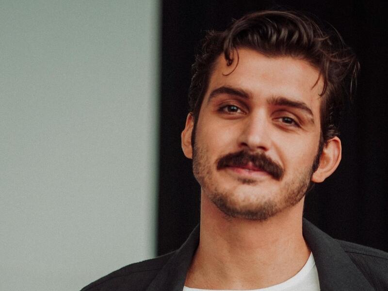 A photo of a man from the waist up