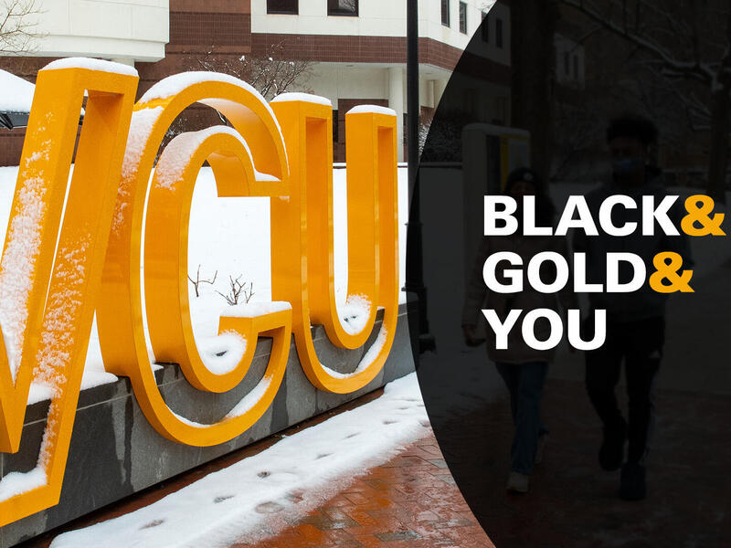A sign made of giant letter that spell \"V C U\" in the snow. Next to it is a black half circle with the text \"BLACK & GOLD & YOU\". 