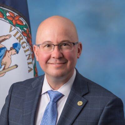 A photo of a man from the shoulders up. j