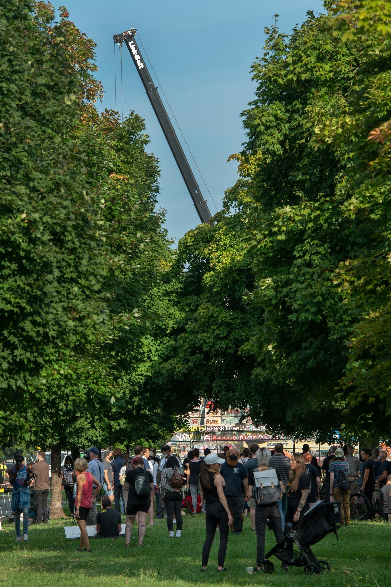 A crane where the Robert E. Lee statue once stood