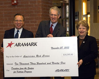Ed Gutauskas, Aramark’s regional operations director, and Paul W. Timmreck, VCU senior vice president for finance and administration, present a $10,395 donation to Kathleen Burke Barrett, CEO, Greater Richmond Chapter of the American Red Cross on behalf of VCU students. 

Photo by Allen Jones, VCU Creative Services