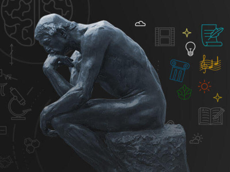 Statue of seated figure.