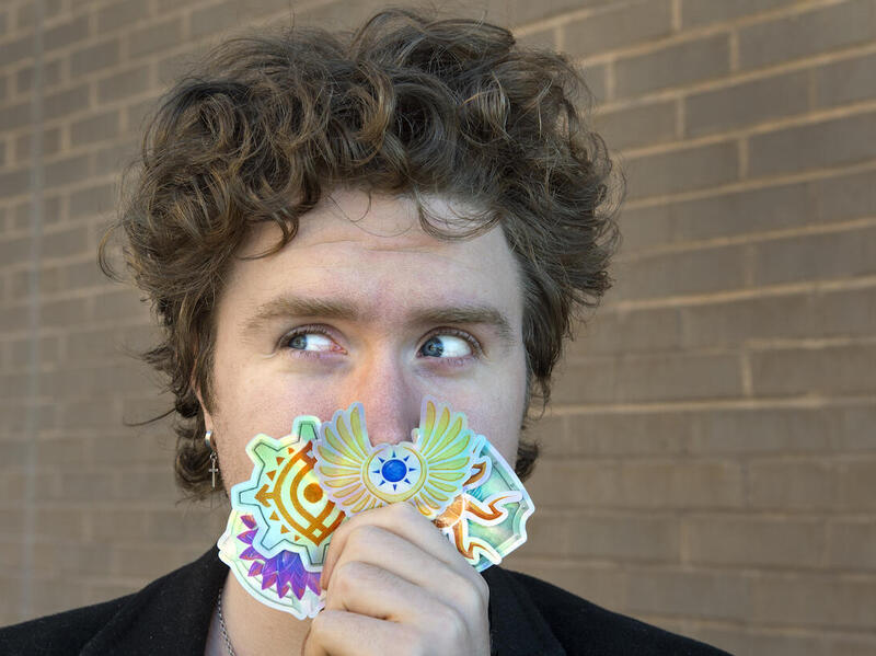Shaw Schiappacasse holding stickers.