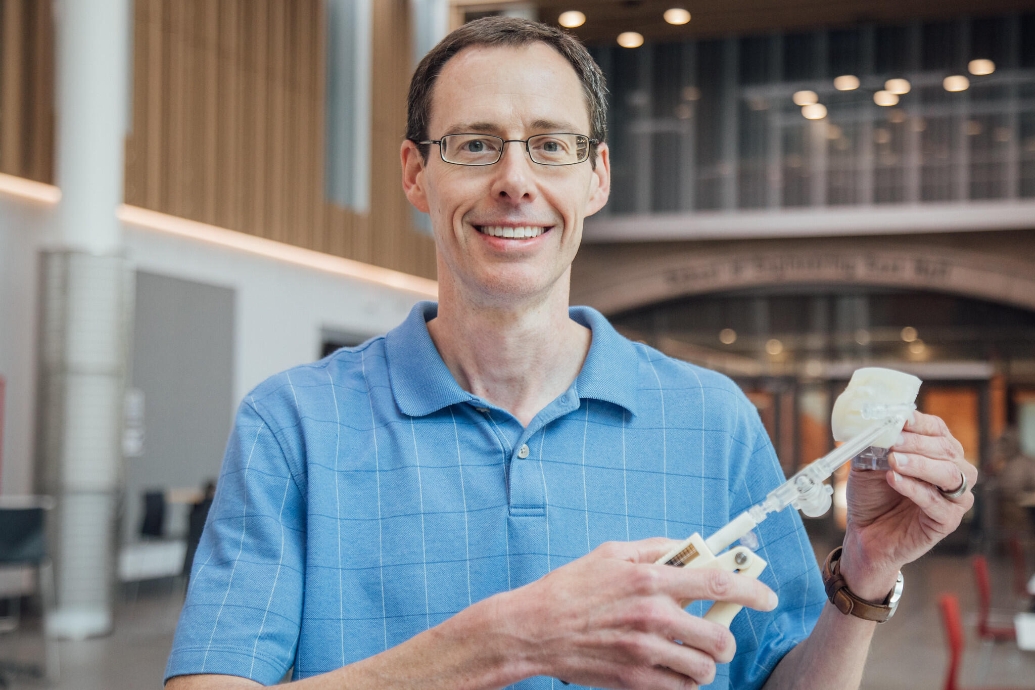 A photo of a man from the chest up.