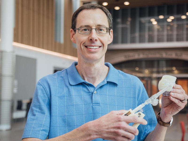 A photo of a man from the chest up.