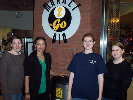 From left: Melissa Blank, Ph.D., assistant professor of psychology and Psi Chi advisor, is joined by Psi Chi officers Michelle Pope,  Kelsey Roberts and Michelle Irby. VCU’s Psi Chi chapter promoted “Waste Week” to reduce food waste at Market 810.  Photo by VCU student Udit Kumar.    