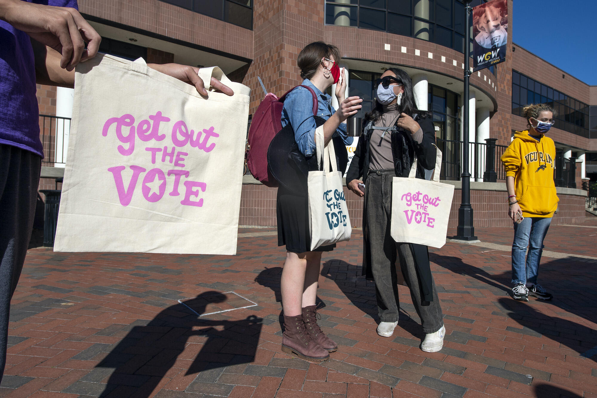 Students screen print tote bags at a VCU Votes event on Oct. 27.