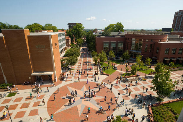Birds-eye view of The Compass on VCU's Monroe Park Campus. Students walking across the plaza.