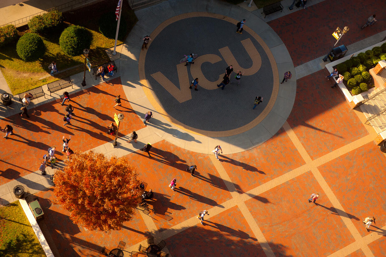 Overhead scene of campus with people walking and large letters VCU.