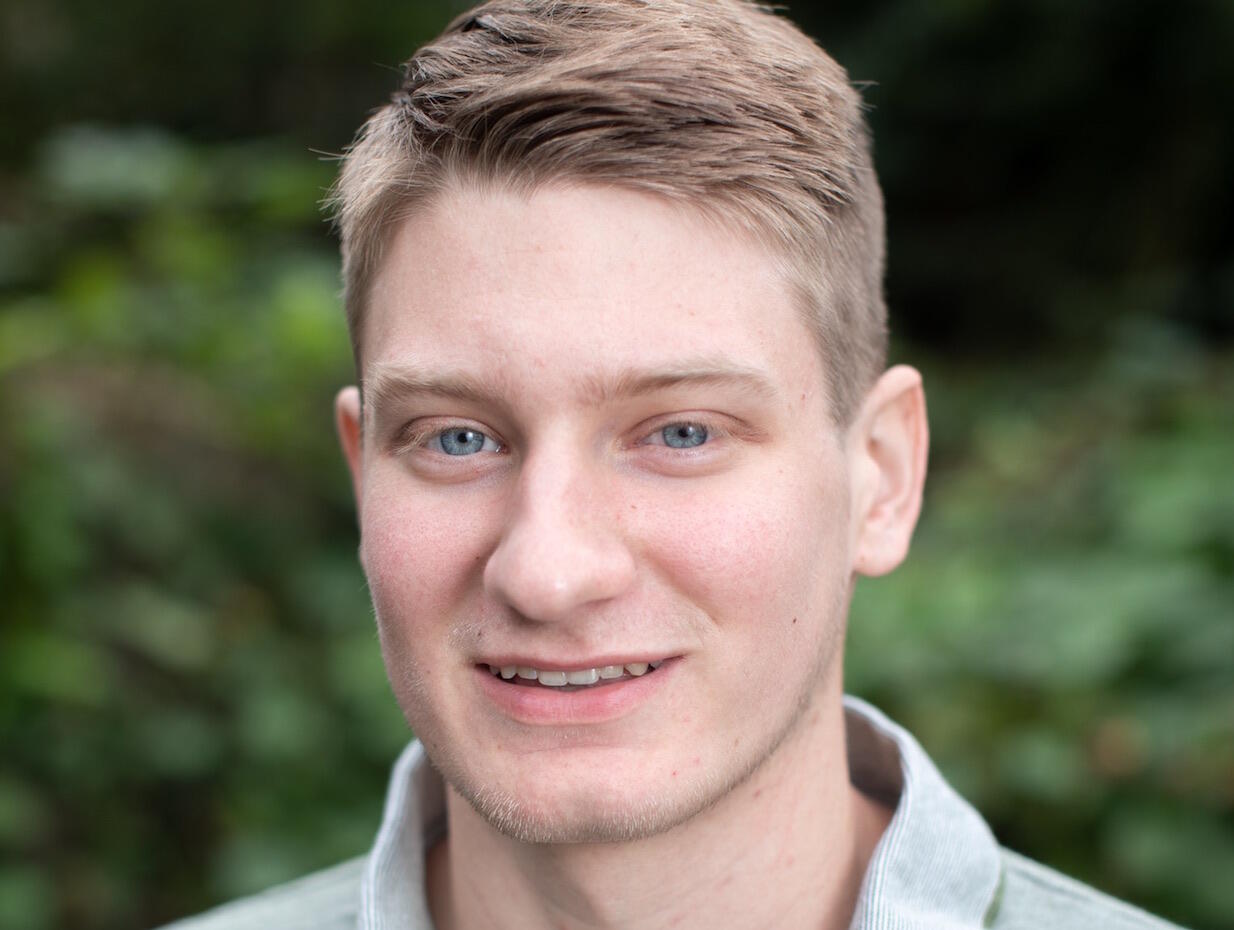 A portrait of Russell Simmers.