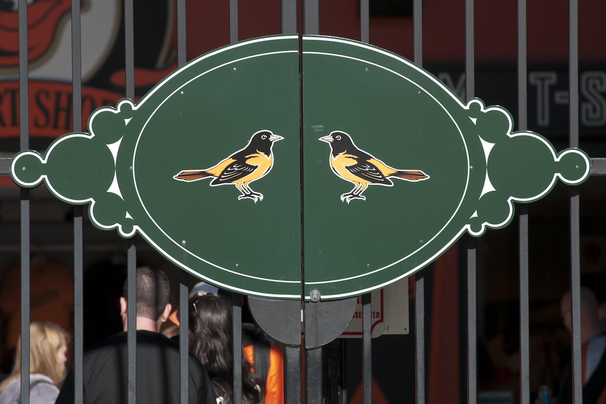 iron gates outside Oriole Park, with the Orioles logo on the face of the gate
