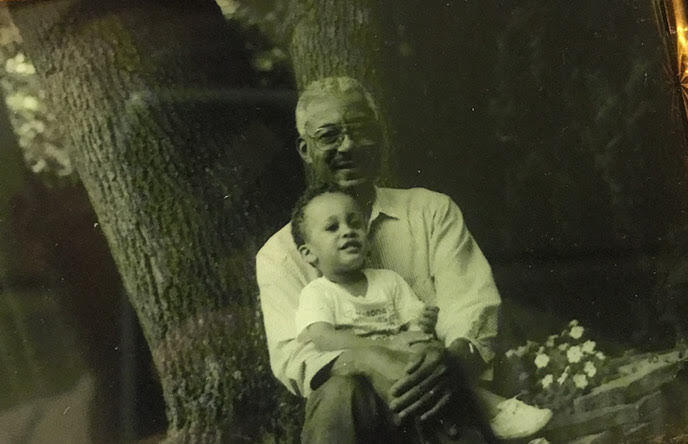 A young Jordan Thomas with his grandfather.