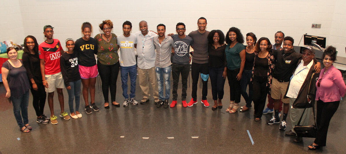 Members of the Eritrean Student Association, riders with the Eritrean National Cycling Team and others gather in the University Student Commons Theater.