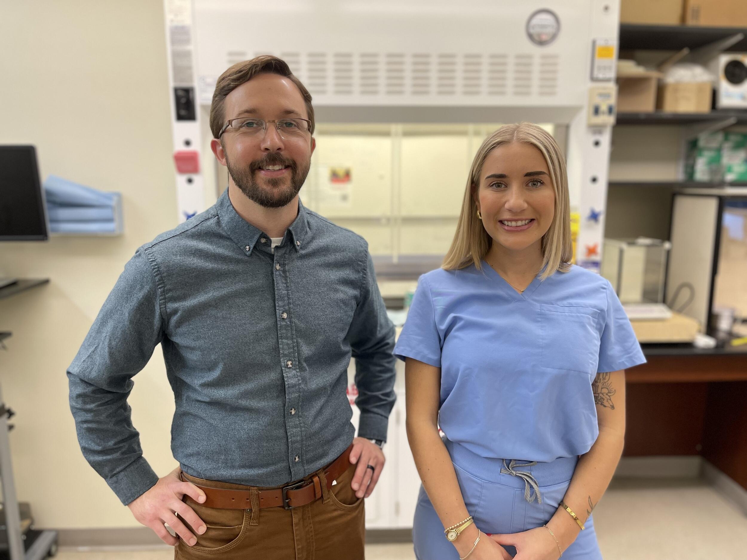 A photo of a man and a woman standing next to each other. 