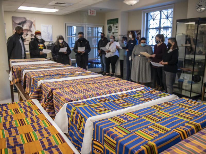 row of boxes containing human remains