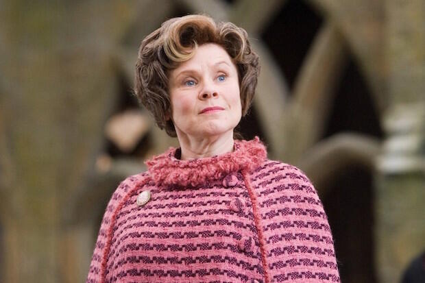 Woman in pink and purple clothes.