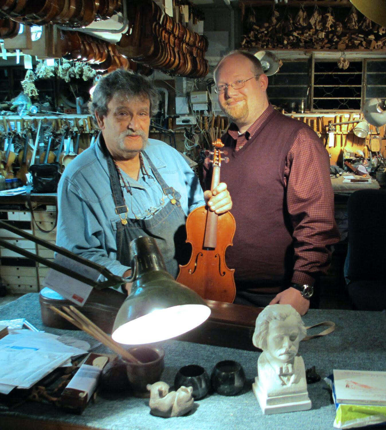 Jay Grymes visits Amnon Weinstein's workshop in Tel Aviv as part of his research on Violins of Hope.