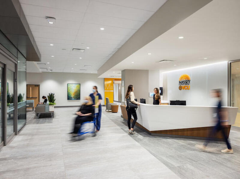 An image of people walking through a lobby