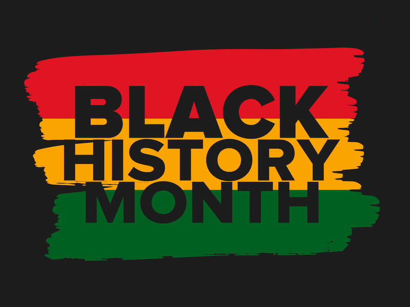 \"Black History Month\" written in front of paint strokes of red, yellow, and green.