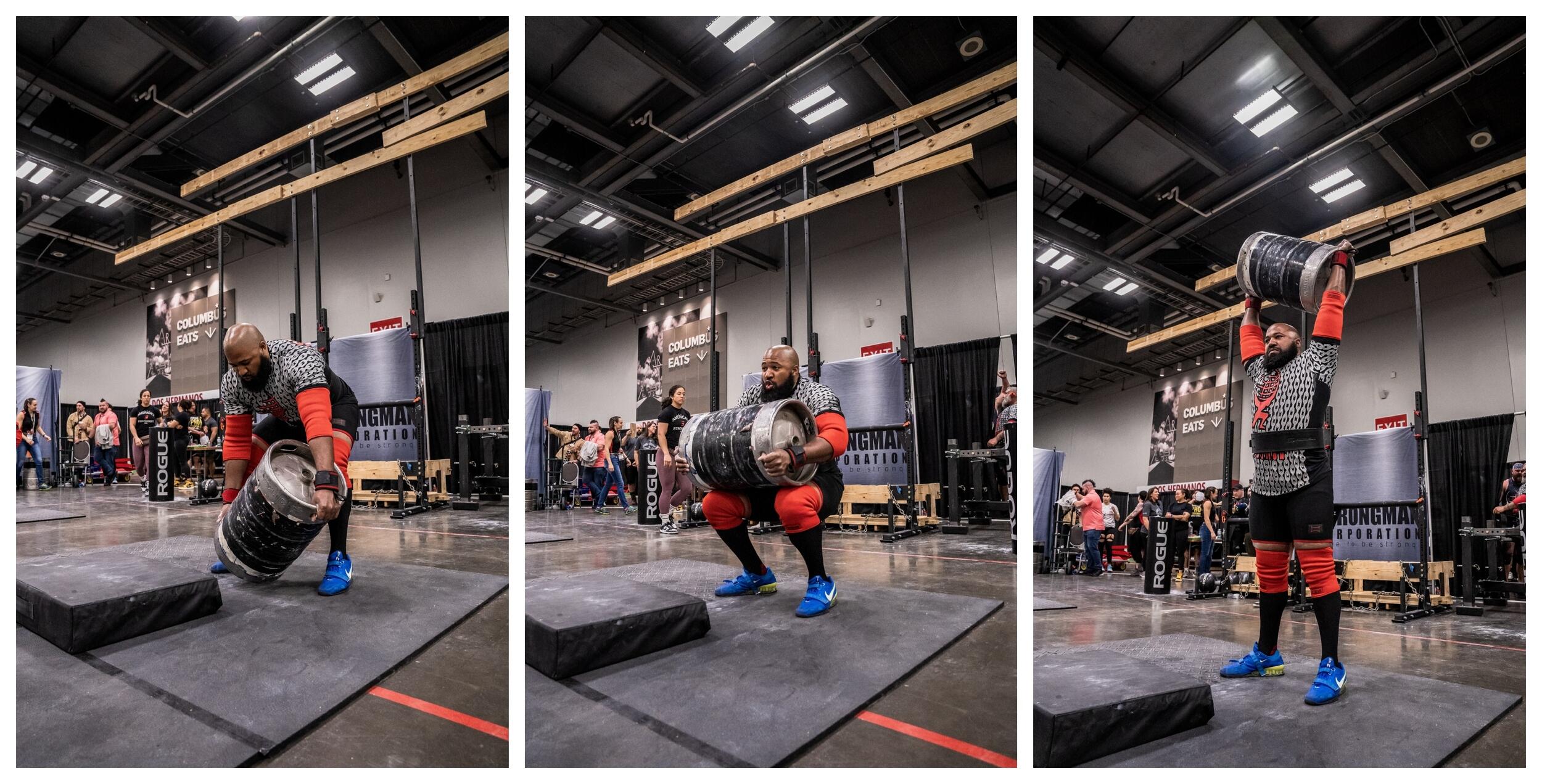 Three photo side by side that show a man going thorugh the process of lifting a barrel up in the air above his head. In the first photo the man has bent over to pick up the barrel, in the second photo he is squating holding the barrel, and in the thrid photo he is standing with the barrel above his head. 