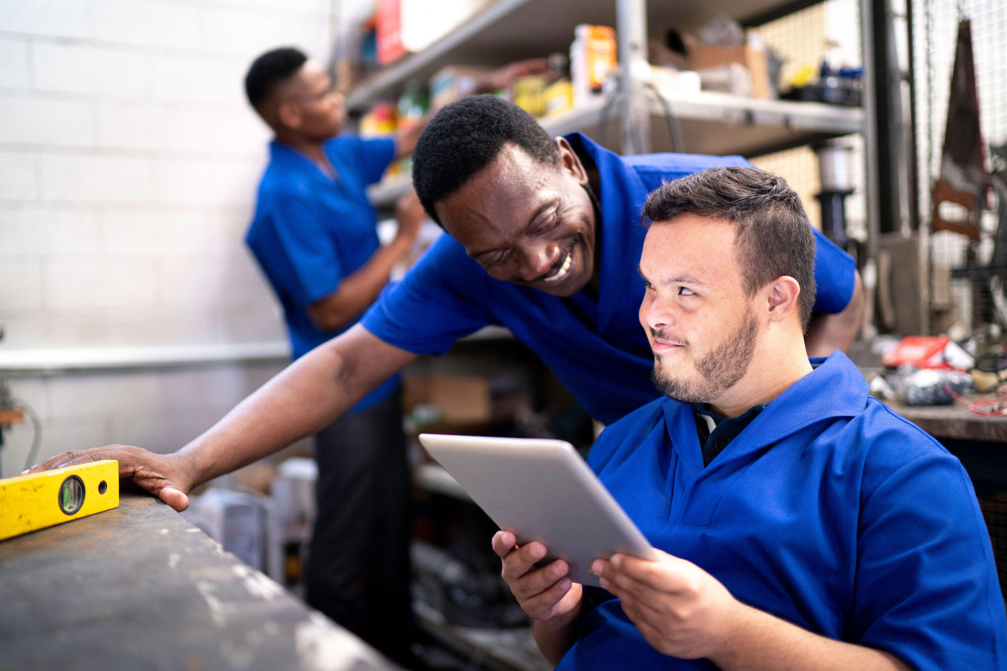 two workers in a back room