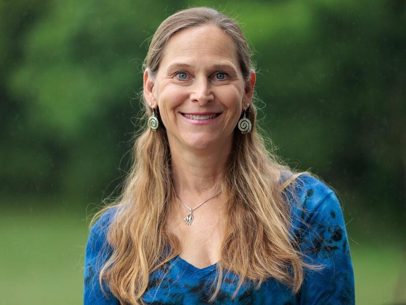 A photo of a woman from the chest up. 