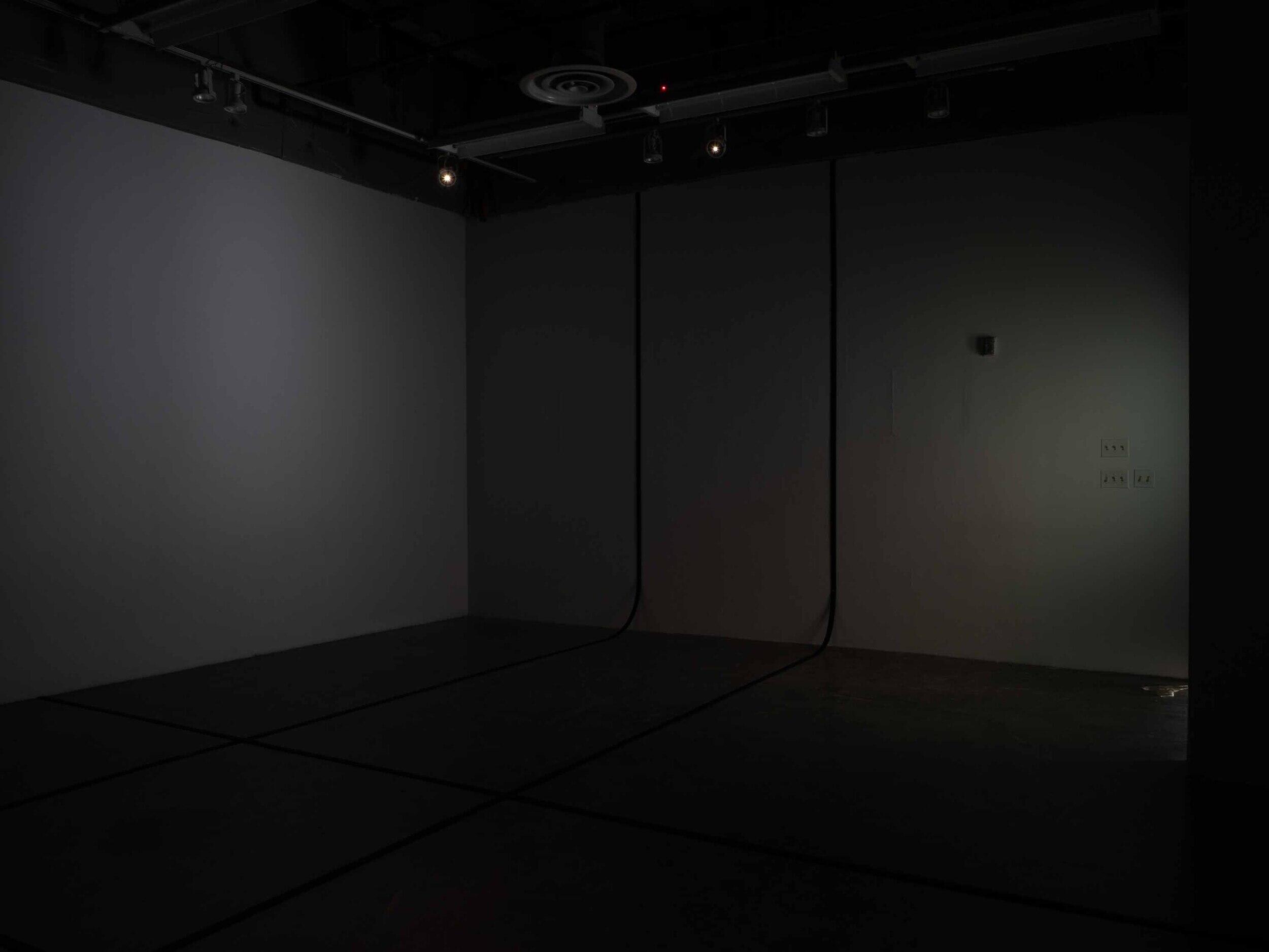 A photo of a dark empty room. 