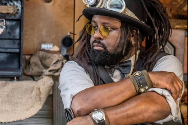 A person standing in a workshop.