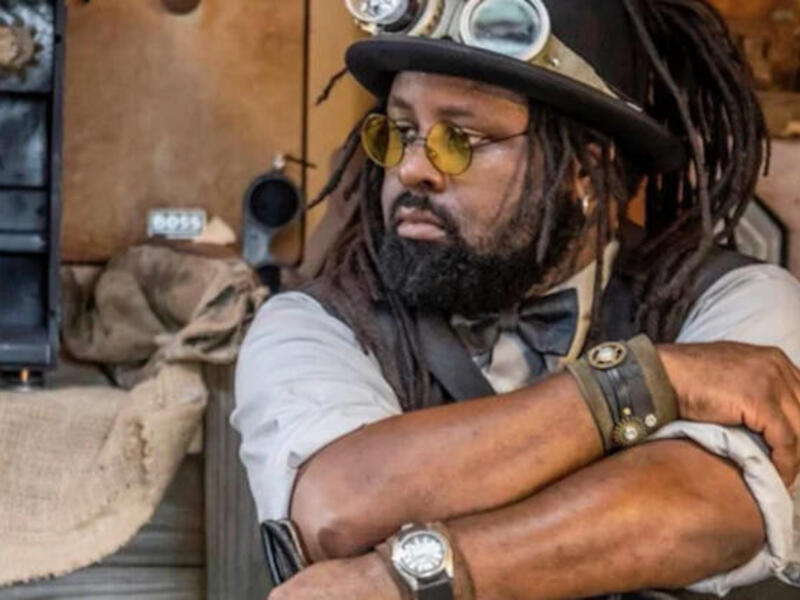 A person standing in a workshop.