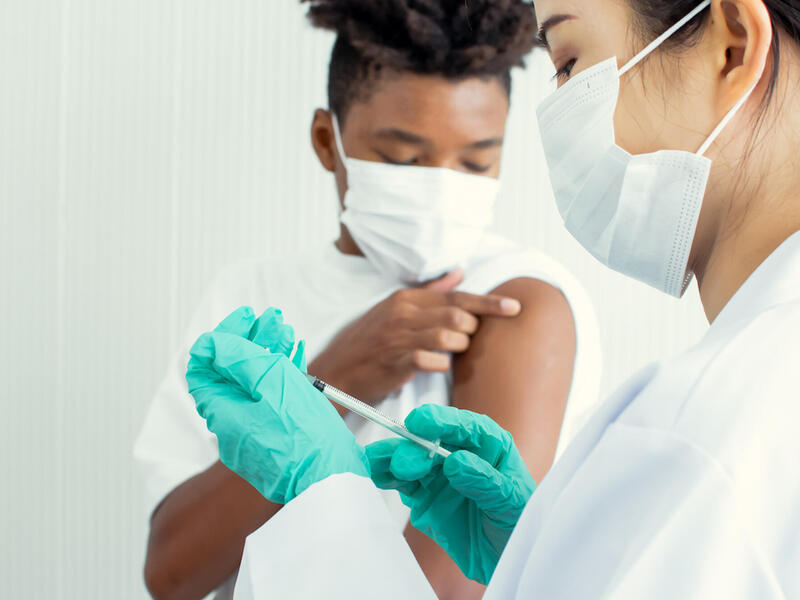 Teenager about to be vaccinated