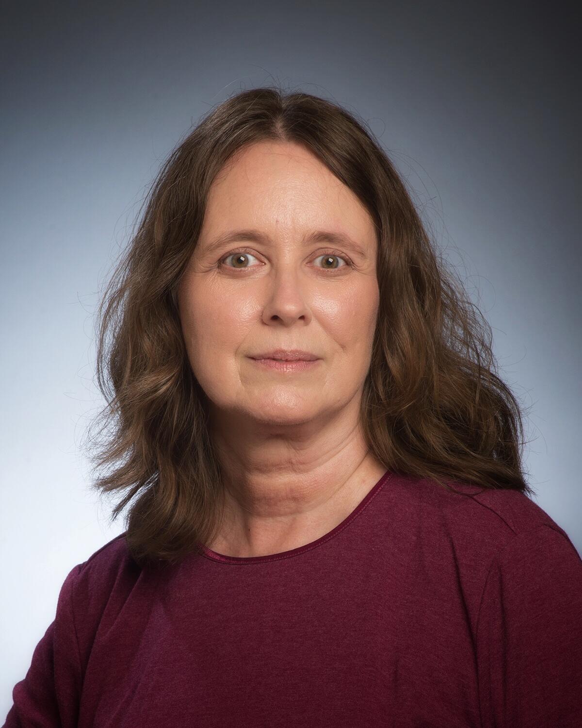 A headshot of a woman