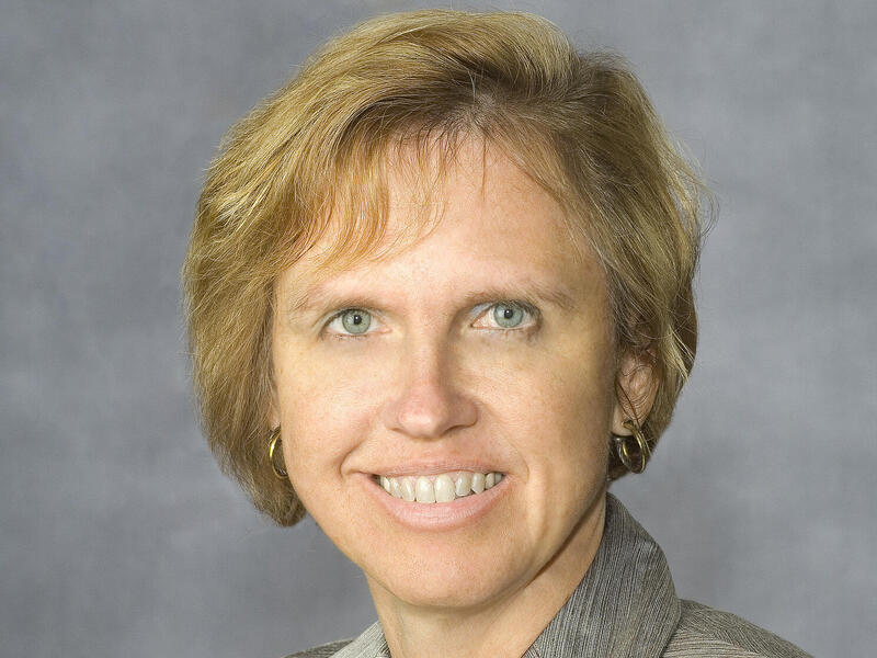 A photo of a woman smiling