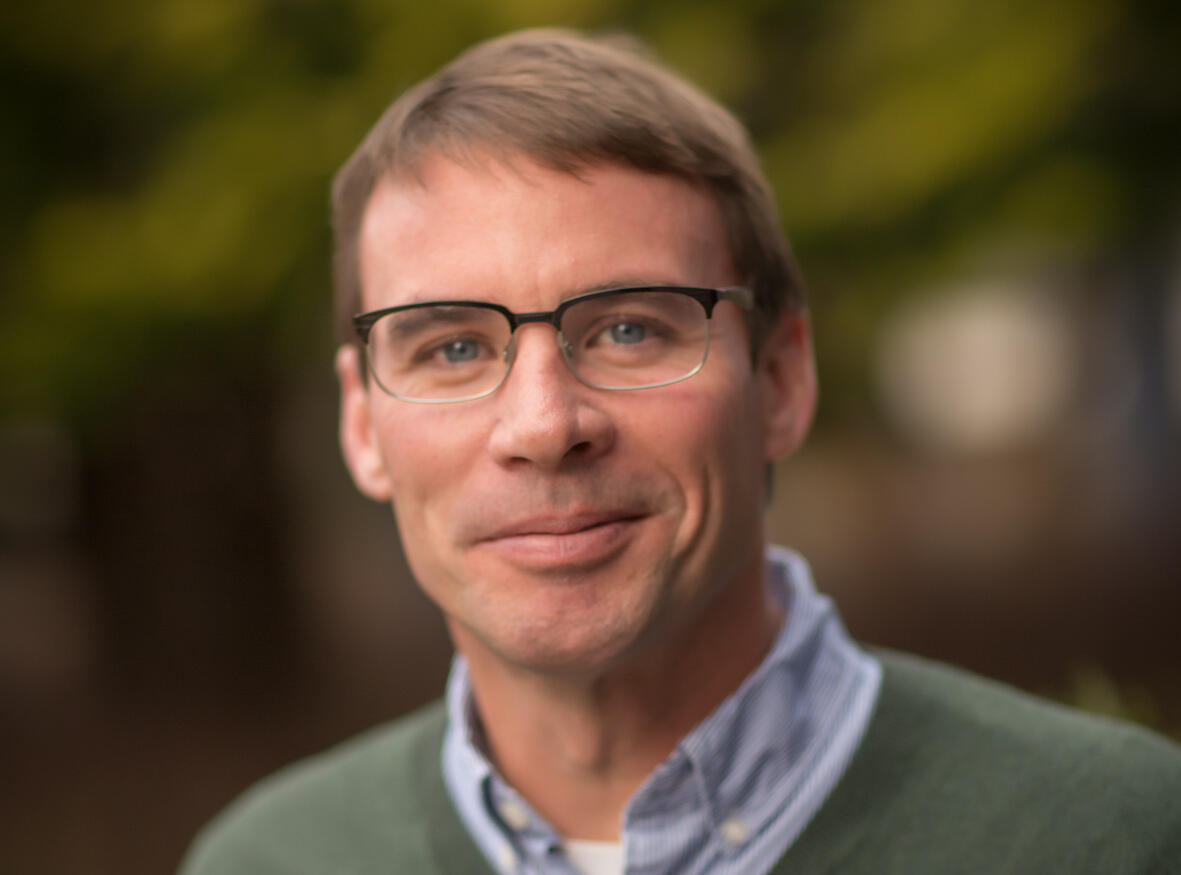 A photo of a man from the chest up. 