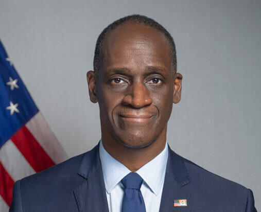 A photo of a man from the chest up. 