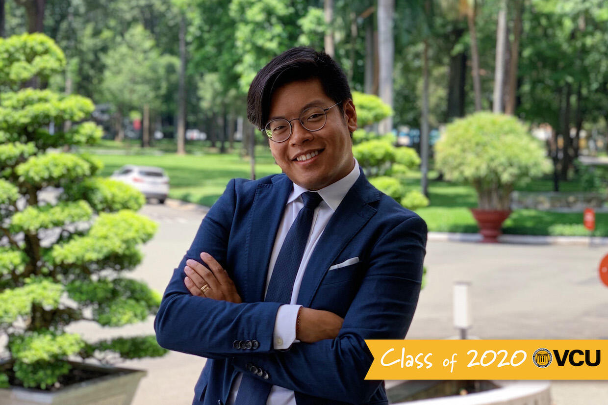 A person in a suit posing for a portrait.