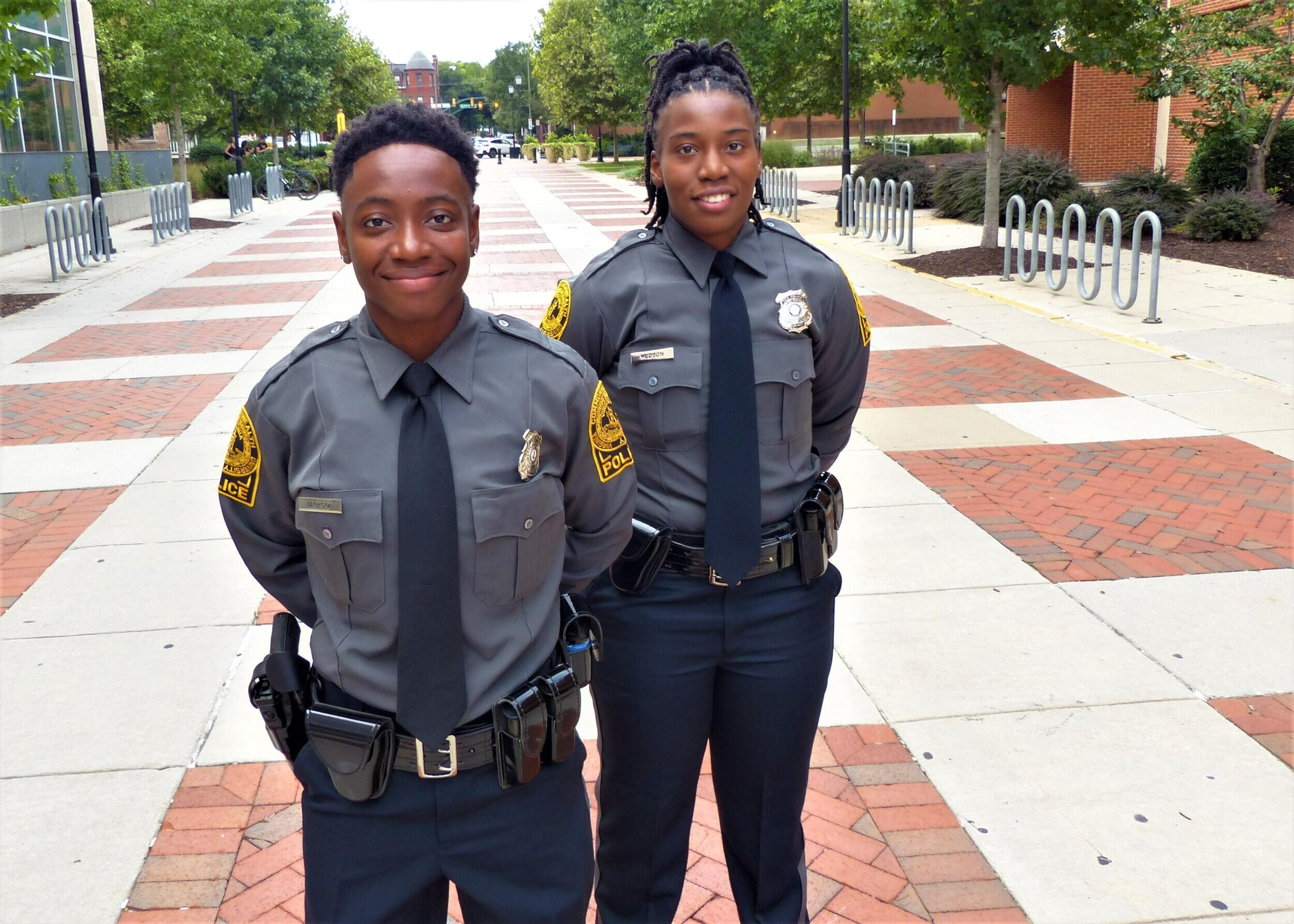 Two police officers standing next to each other 