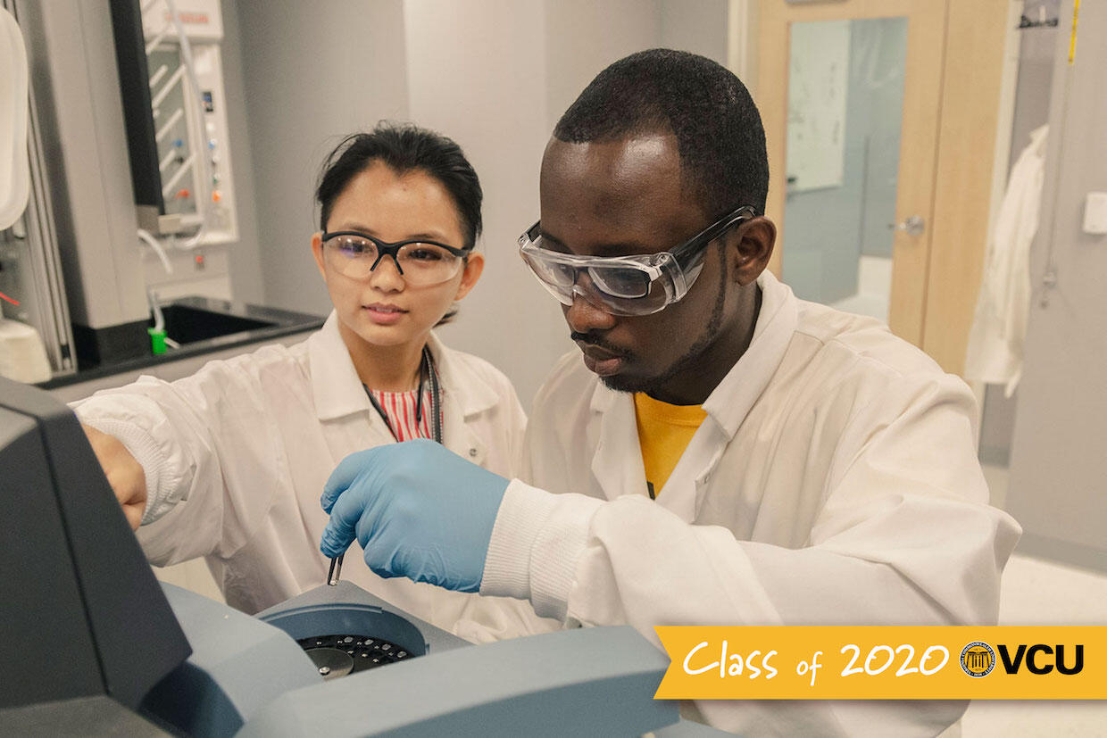Two people working in a laboratory.