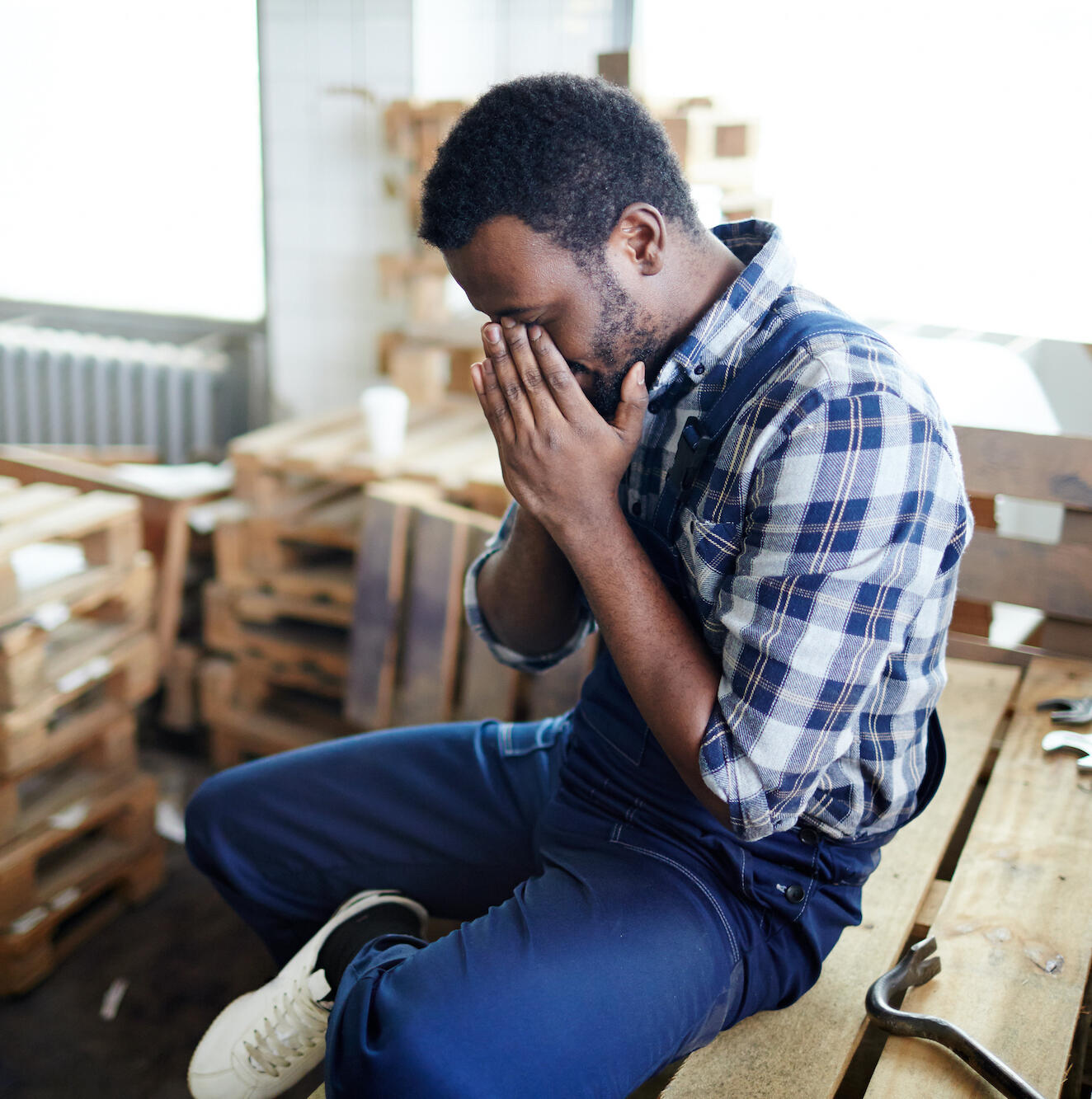 Black man at work and in pain