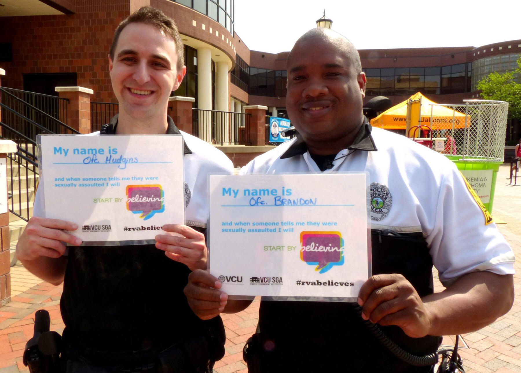 VCU Police Officers Andrew Hudgins and Michael Brandon sign Start By Believing pledges in April 2014. VCU Police joined the national Start by Believing awareness campaign to encourage friends and family members of sexual assault victims to believe them, and be supportive of them, when they disclose an assault.