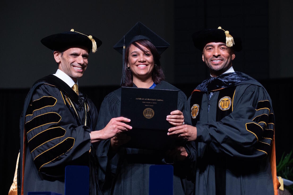 Sarah Izabel receives the VCU Board of Visitors Award at the university's spring commencement ceremony.