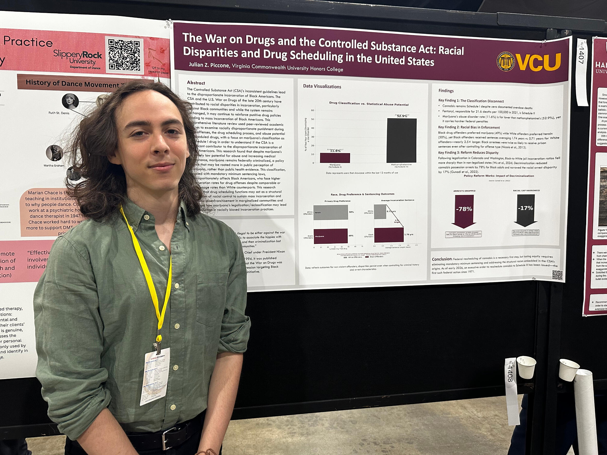 A man stands in front of a research poster board.