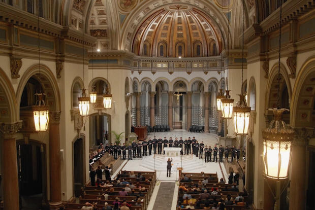 Choir singers performing inside Richmond's Cathedral of the Sacred Heart 