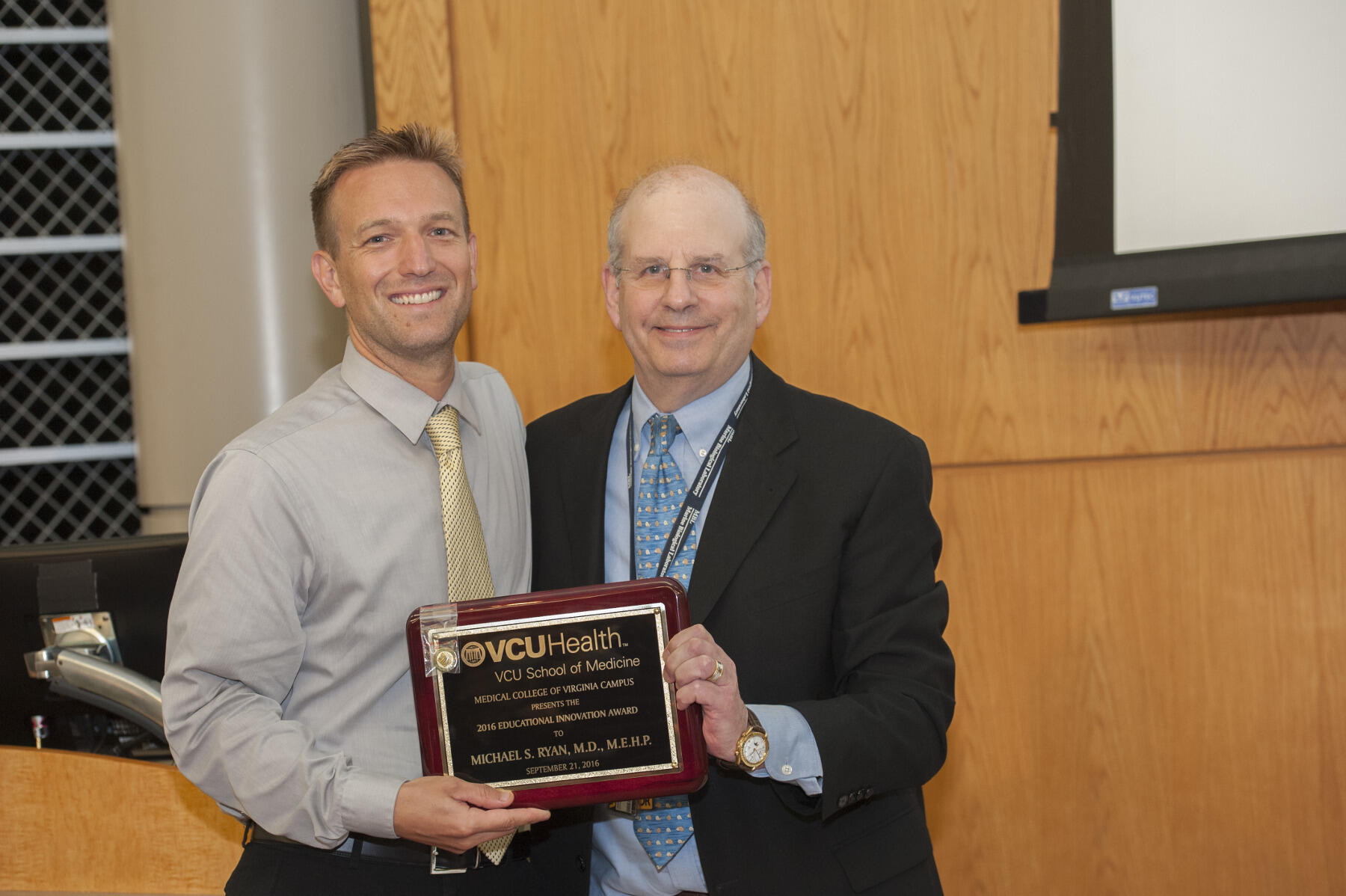Michael S. Ryan (left), M.D., associate professor in the Department of Pediatrics, was this year’s recipient of the Educational Innovation Award. Jerome Strauss (right), M.D., Ph.D., dean of VCU School of Medicine, presented the award.
