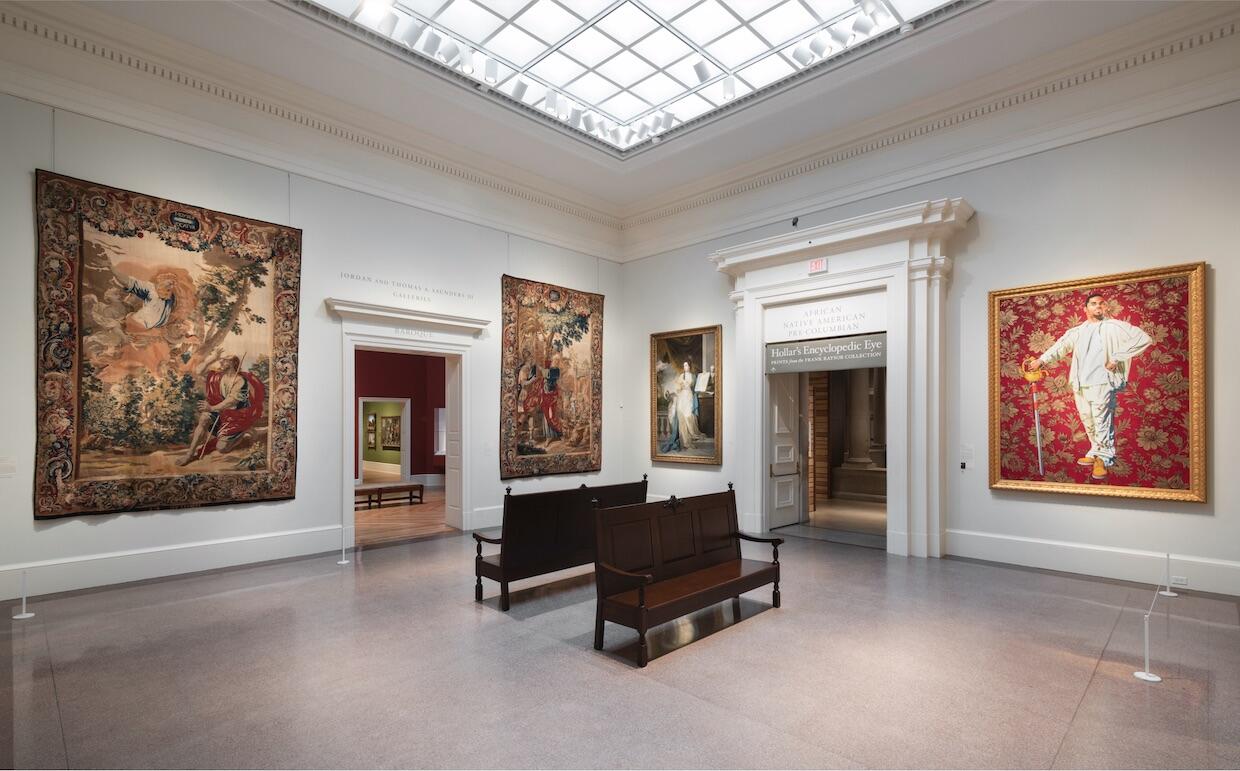 Kehinde Wiley’s painting, “Willem van Heythuysen,” right, hangs in the VFMA’s Tapestry Hall alongside traditional 17th to 19th century European paintings.