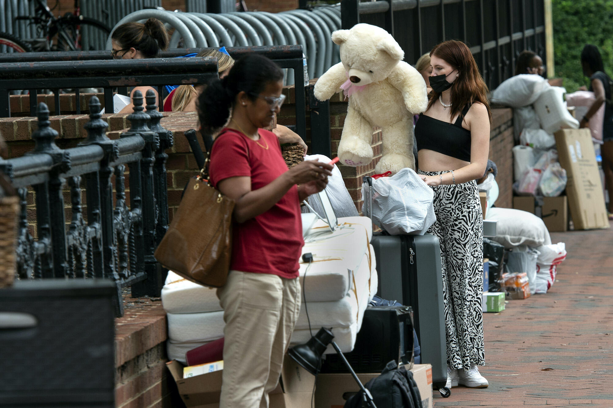 Trish Hukill of Northern Virginia with her stuffed bear, outside Rhodes Hall.