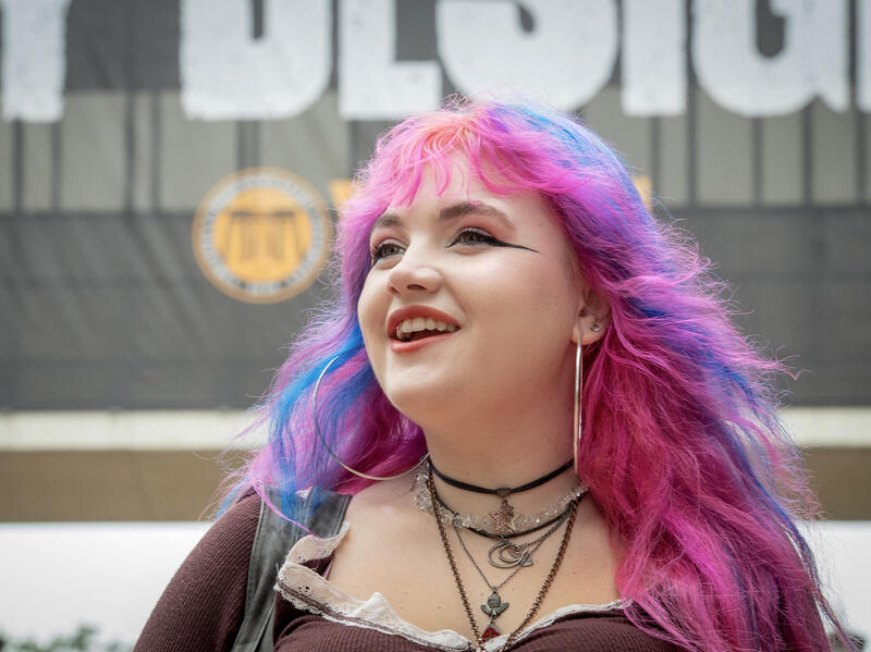 A photo of a woman from the shoulders up. 