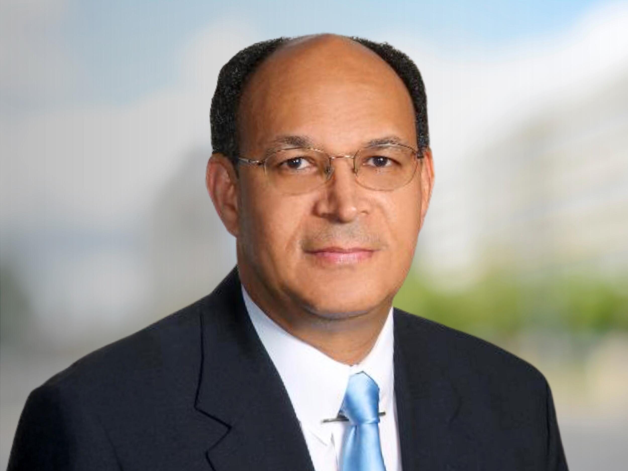 A photo of a man from the chest up. 