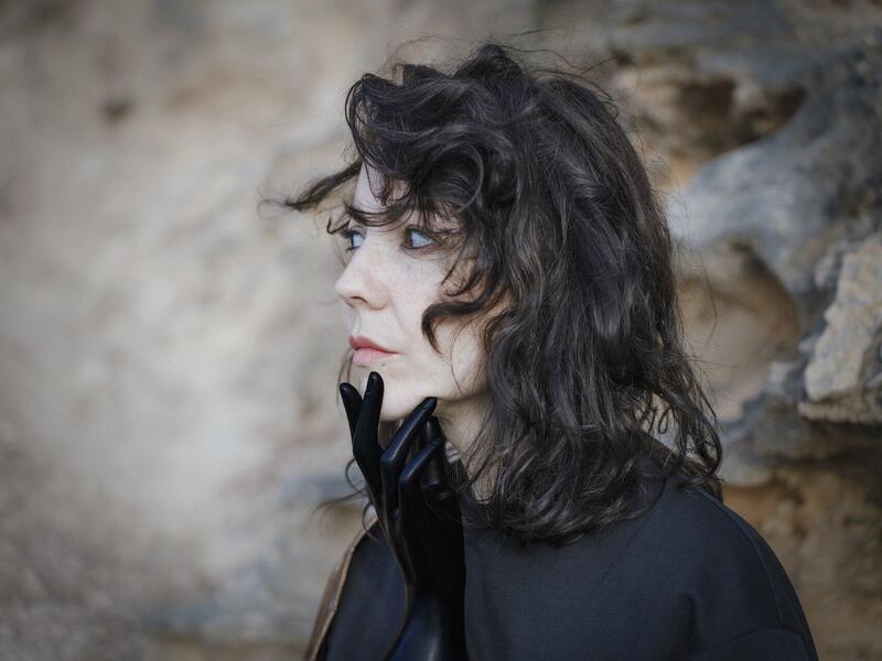 A photo of a profile of a woman looking to the left. 