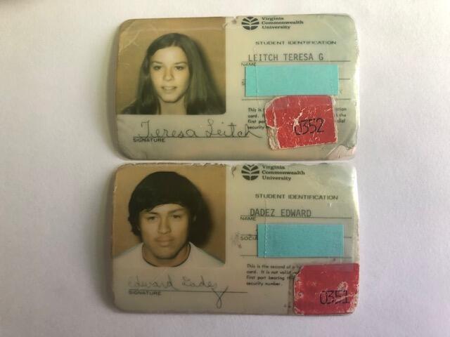 A woman's ID card and a man's ID card are laid out one on top of the other.