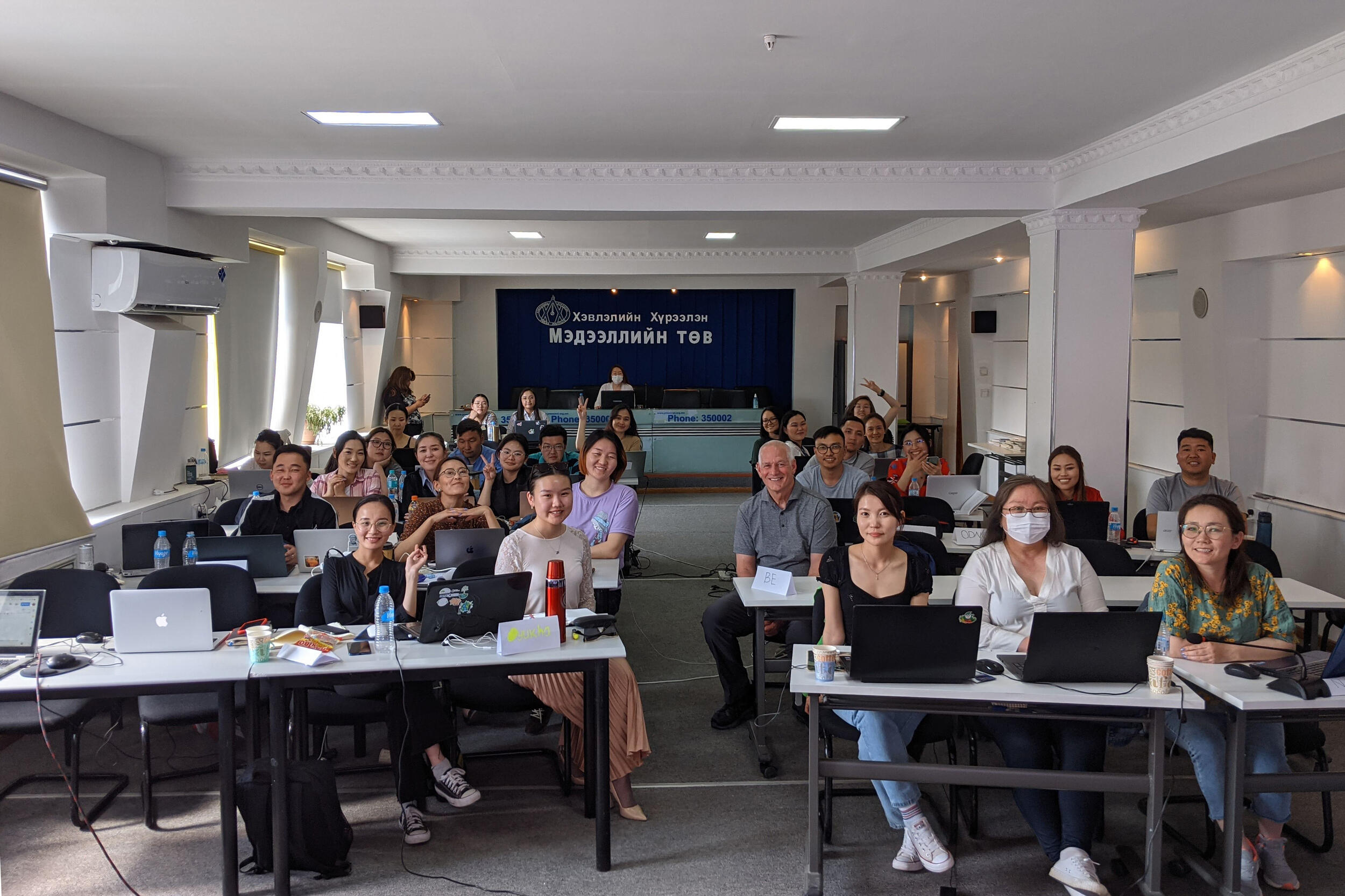 Jeff South sitting with a classroom full of students 